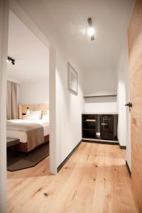 Łóżko lub łóżka w pokoju w obiekcie Hotel & Appartements Tiroler Buam