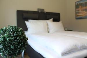 Postel nebo postele na pokoji v ubytování Støren Hotel
