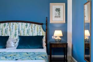 Hotel Baglio Oneto dei Principi di San Lorenzo - Luxury Wine Resort客房内的一张或多张床位