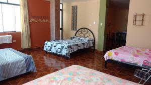 Кровать или кровати в номере Casa Familiar Eventos y Recepciones Huanchaco Huanchaquito