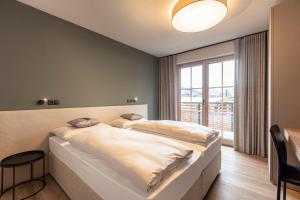 Posteľ alebo postele v izbe v ubytovaní Chalet 149 Westendorf by ALPS RESORTS