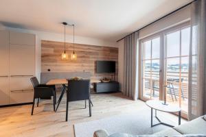 Televízia a/alebo spoločenská miestnosť v ubytovaní Chalet 149 Westendorf by ALPS RESORTS