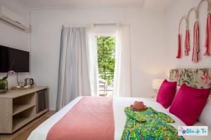 Postel nebo postele na pokoji v ubytování Bleu de Toi Boutique Guesthouse
