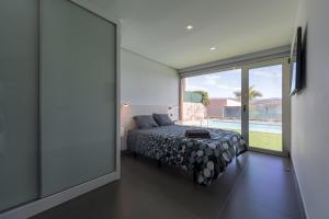 Postel nebo postele na pokoji v ubytování Villa Paradise + 17 fotografií