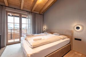 Posteľ alebo postele v izbe v ubytovaní Chalet 149 Westendorf by ALPS RESORTS