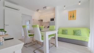 a kitchen and living room with a table and chairs at Sebastian in Novigrad Istria