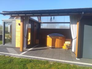 a patio with a gazebo and a trash can at Willa Biały Jeleń Jacuzzi & Sauna in Białka Tatrzańska