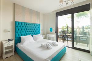 Rúm í herbergi á Tridente Mare Apart Hotel