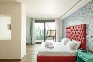 Rúm í herbergi á Tridente Mare Apart Hotel
