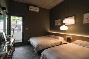 Postel nebo postele na pokoji v ubytování SI Hotel