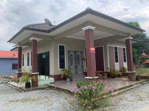 a small house with a porch at RK ASIANA HOMESTAY, KEMAMAN in Cukai