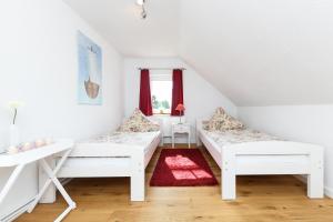 Postel nebo postele na pokoji v ubytování Nordsee Landhuus Heinken