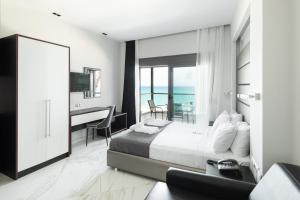 Rúm í herbergi á Tridente Mare Apart Hotel