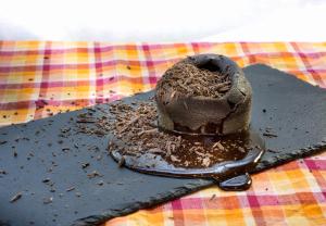 a piece of chocolate cake on a spatula at The Raintree, St. Mary’s Road in Chennai