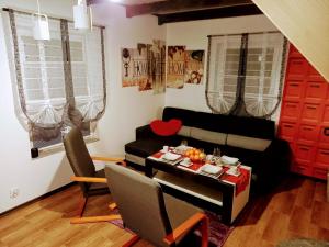 a living room with a couch and a table at Agroturystyka u Cezarego in Liniewo