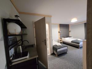 Posteľ alebo postele v izbe v ubytovaní Karolowy pokoje&apartamenty