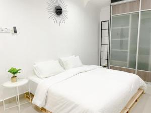 Un pat sau paturi într-o cameră la Mas Homestay