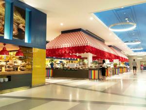 a food court in a shopping mall with people in it at The Land Of Legends Kingdom Hotel - All-in Concept in Belek