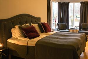 Voodi või voodid majutusasutuse First Hotel Olofström toas