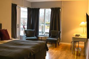 Voodi või voodid majutusasutuse First Hotel Olofström toas