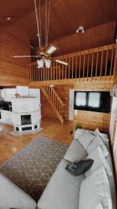 a bedroom with a bed and a wooden ceiling at Jukuvilla in Kalajoki