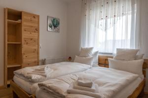 Säng eller sängar i ett rum på Gästehaus Jägerstüble