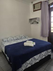 Voodi või voodid majutusasutuse Pousada Caravelas - Centro de Paraty toas