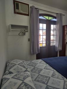 Voodi või voodid majutusasutuse Pousada Caravelas - Centro de Paraty toas
