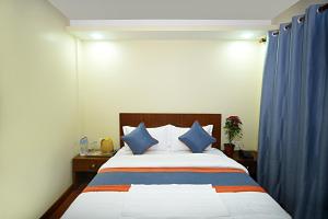 Letto o letti in una camera di Karma Hotel Nepal