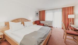 Łóżko lub łóżka w pokoju w obiekcie Hotel & Appartements Tiroler Buam