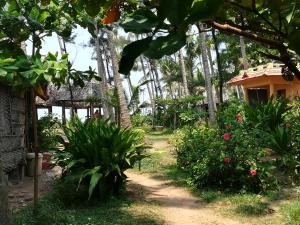 Zahrada ubytování Sukriti beach Resort