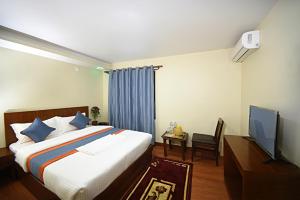 Letto o letti in una camera di Karma Hotel Nepal