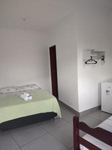 Voodi või voodid majutusasutuse Pousada Caravelas - Centro de Paraty toas