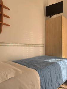 Letto o letti in una camera di Albergo Moderno