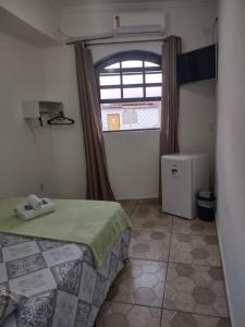 Voodi või voodid majutusasutuse Pousada Caravelas - Centro de Paraty toas