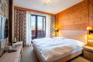 Ein Bett oder Betten in einem Zimmer der Unterkunft Kukučka Lomnica - Tatranská Lomnica