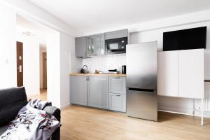 Kuchyňa alebo kuchynka v ubytovaní Dom Pod Gubałówką - Zakopane Apartamenty