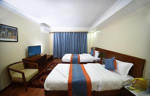 Letto o letti in una camera di Karma Hotel Nepal