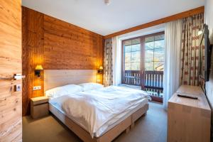 Ein Bett oder Betten in einem Zimmer der Unterkunft Kukučka Lomnica - Tatranská Lomnica