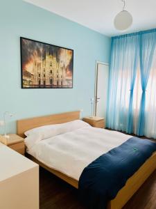 Postel nebo postele na pokoji v ubytování Via Padova 165