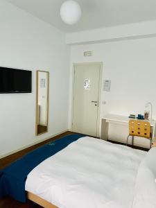Postel nebo postele na pokoji v ubytování Via Padova 165