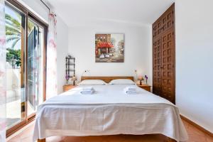 Ein Bett oder Betten in einem Zimmer der Unterkunft Villas Guzman - Flores