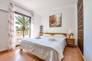 Ein Bett oder Betten in einem Zimmer der Unterkunft Villas Guzman - Flores