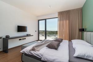 Postel nebo postele na pokoji v ubytování Villa Sabina