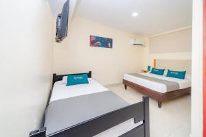Säng eller sängar i ett rum på Ayenda Baly Express