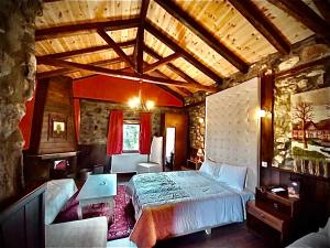 A bed or beds in a room at Chalet Asteras tou Vorra