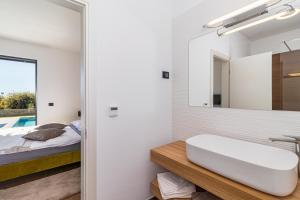Postel nebo postele na pokoji v ubytování Villa Sabina