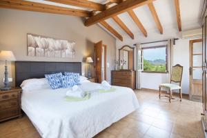 Posteľ alebo postele v izbe v ubytovaní Owl Booking Villa Tia - Exclusive Holidays
