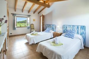 Posteľ alebo postele v izbe v ubytovaní Owl Booking Villa Tia - Exclusive Holidays