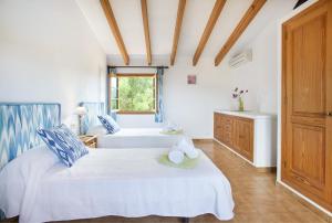 Posteľ alebo postele v izbe v ubytovaní Owl Booking Villa Tia - Exclusive Holidays